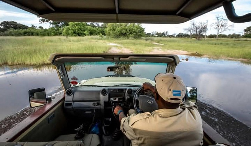 Swimming on wheel through wilderness water crossing in the Delta